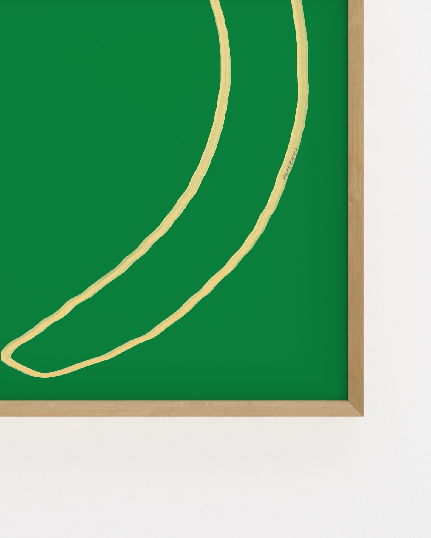 Minimal banana illustration on a green background
