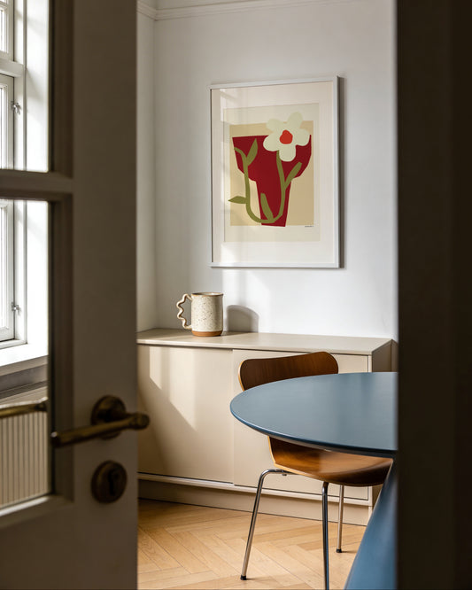 Modern floral print featuring a red vase, white flower and minimalist botanical design in warm neutral tones