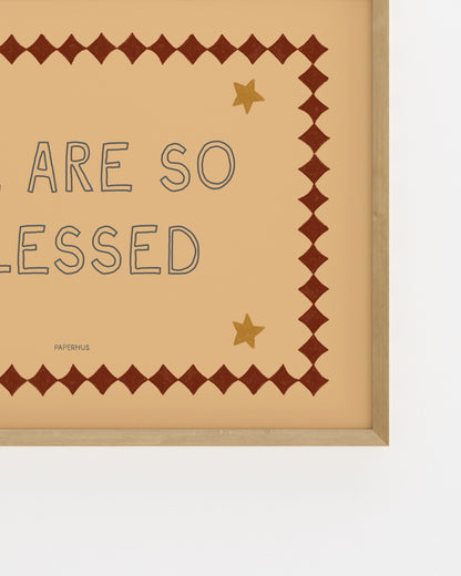 Inspirational typography print reading “We Are So Blessed” with vintage-style border and star details