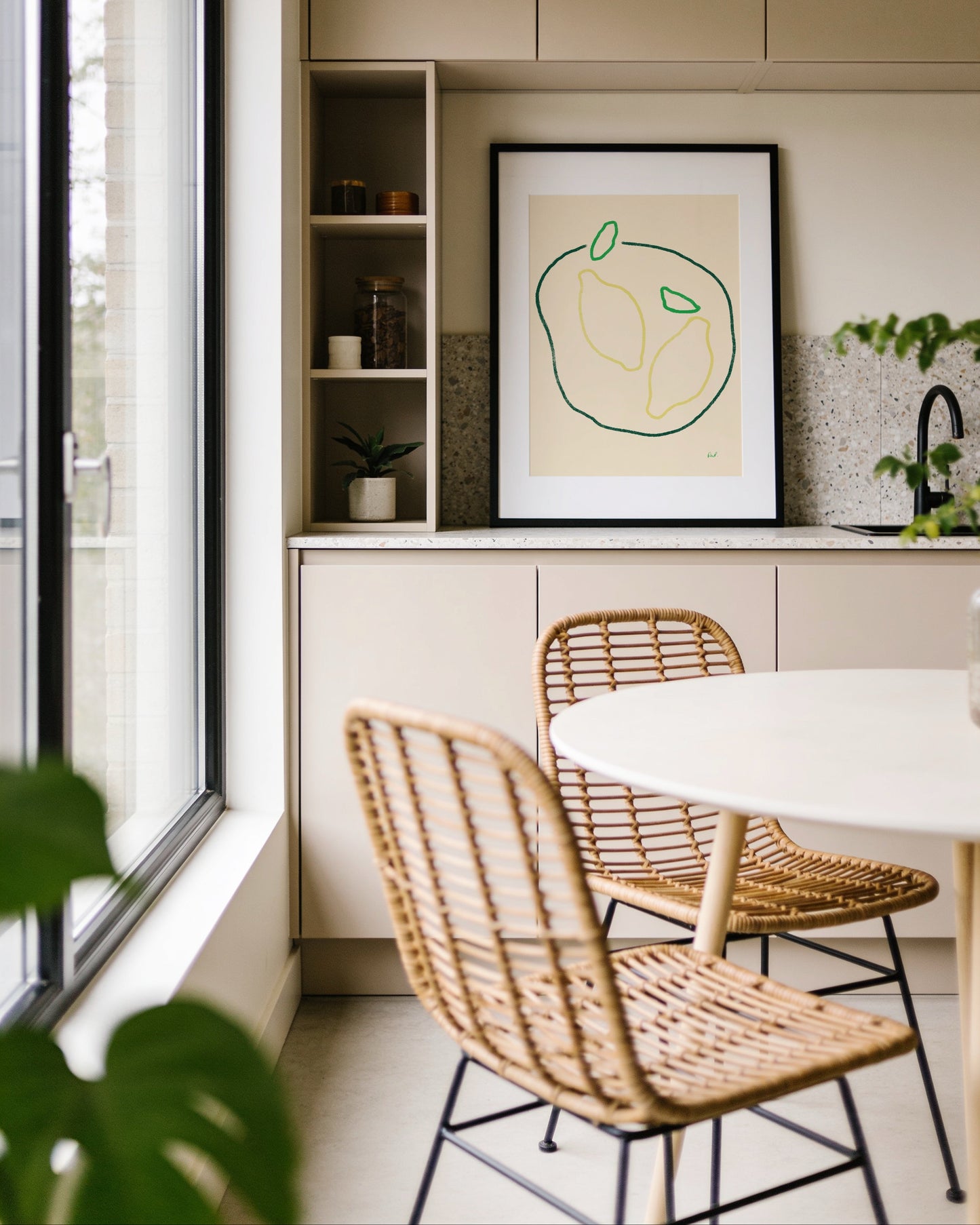Minimalist hand-drawn lemon printable wall art featuring two lemons with green leaves on a soft cream background.