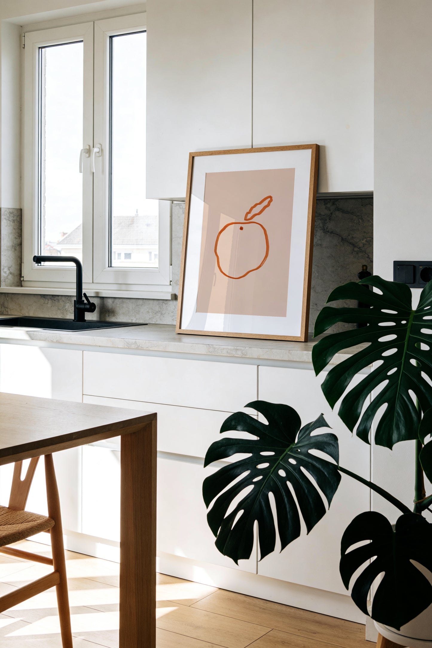 Minimal orange illustration on a blush pink background
