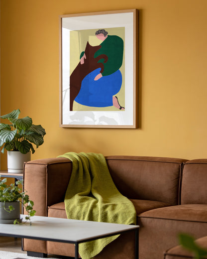 Colourful figurative printable wall art of a seated woman in blue trousers and a green top cuddling a large brown dog.