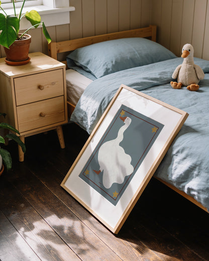 Vintage-inspired goose illustration on a soft blue background with star details for a nursery or children’s room